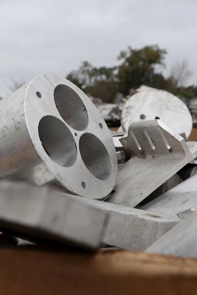 Industry scrap metal is broken down at a GLE Scrap Metal recycling center