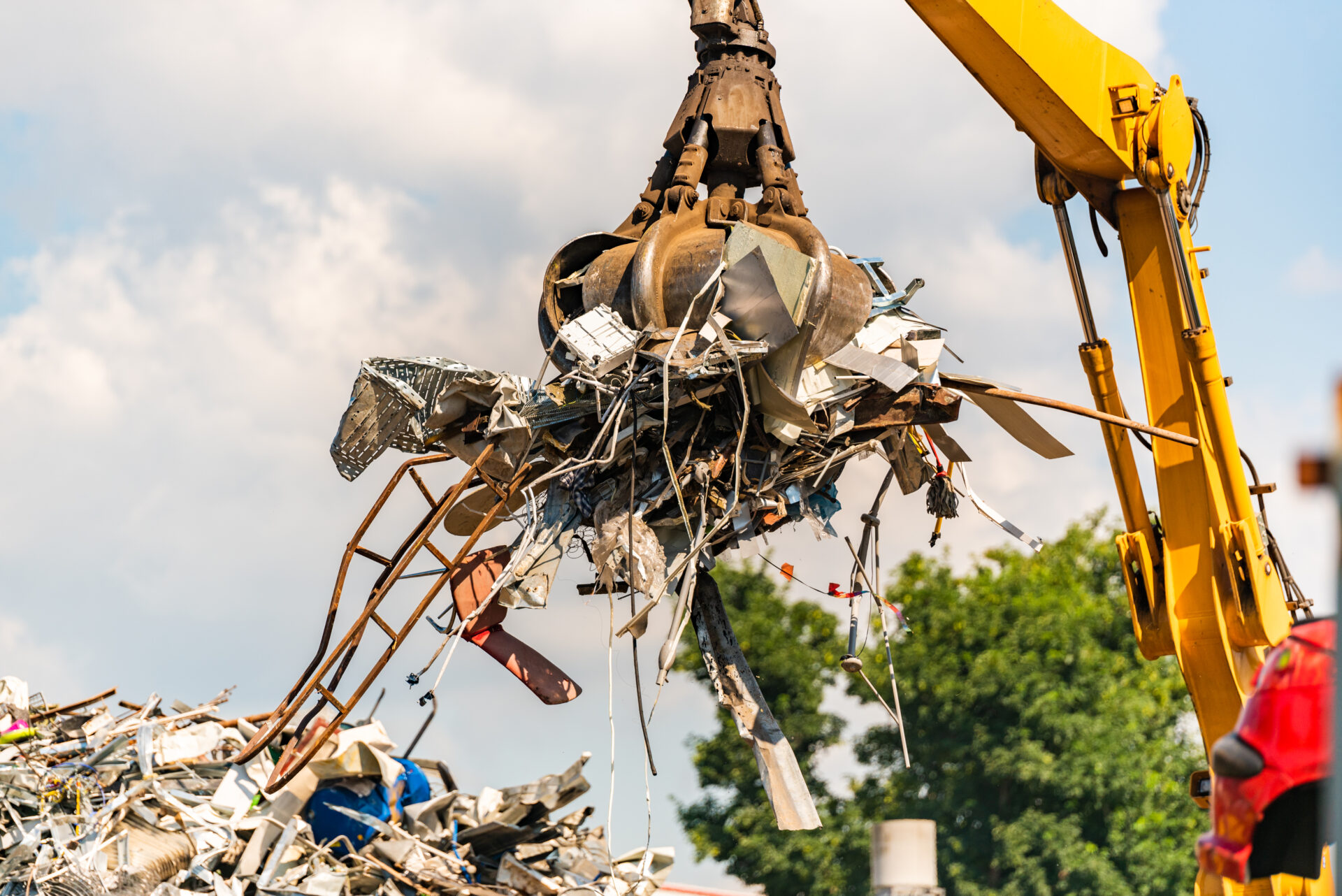 Close-up of a crane for recycling metallic waste construction and demolition scrap metal